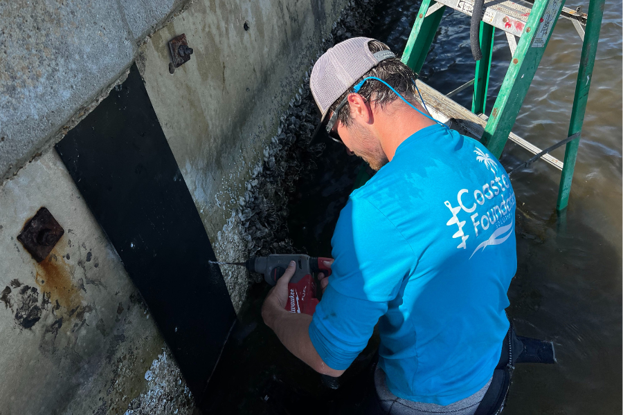 Man Installing Seawall Seam to Florida Concrete Seawall